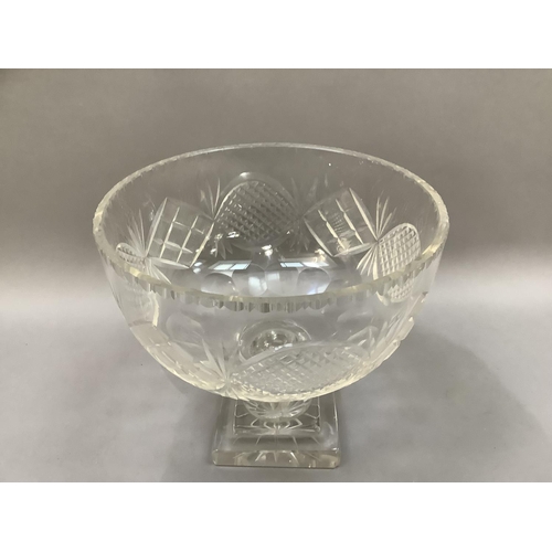 30 - An early 20th century cut glass pedestal fruit bowl cut with panels of diamonds and ovals,  panel cu... 