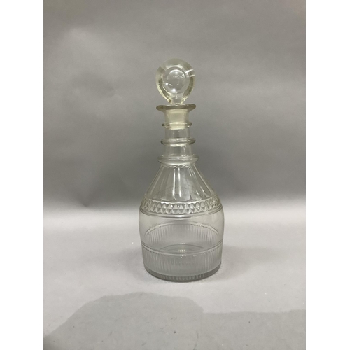 5 - A George III triple collar glass decanter, panel cut and with target stopper, 28cm high