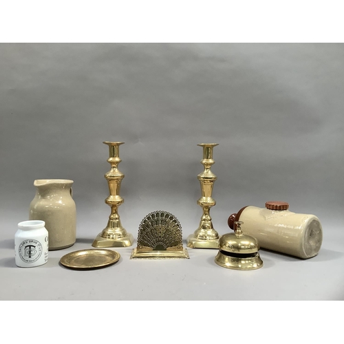 101 - A pair of Victorian brass candlesticks, a later desk bell, a letter rack, Benares trinket tray, a st... 