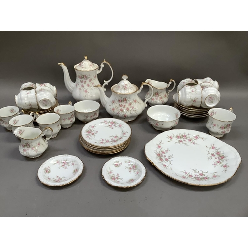 121 - A Paragon china tea and coffee service of Victoriana rose pattern comprising teapot, coffee pot, two... 