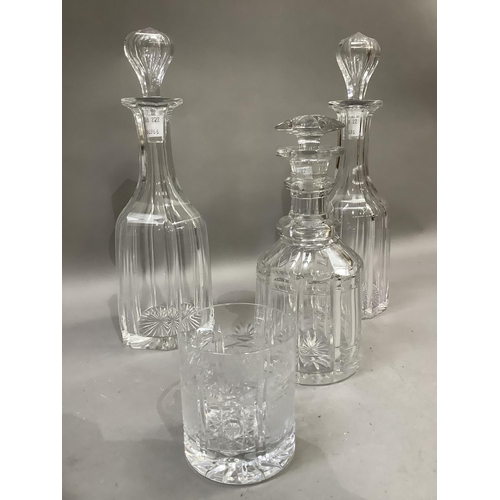 127 - A pair of 19th century decanters of mallet shape, the blown panel stoppers inset with tear, panel cu... 