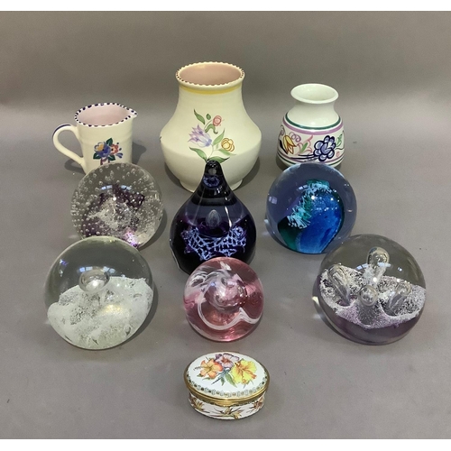 133 - Six glass paperweights including Caithness examples, a Staffordshire enamel pill box, a Poole potter... 