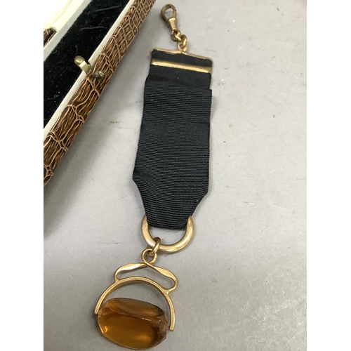 248 - A George V pocket watch fob ribbon with swivel fastener, amber paste and rolled gold fittings