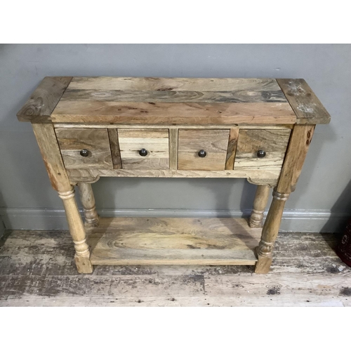 78 - A modern hardwood side table of four square drawers on turned uprights joined by a platform and squa... 