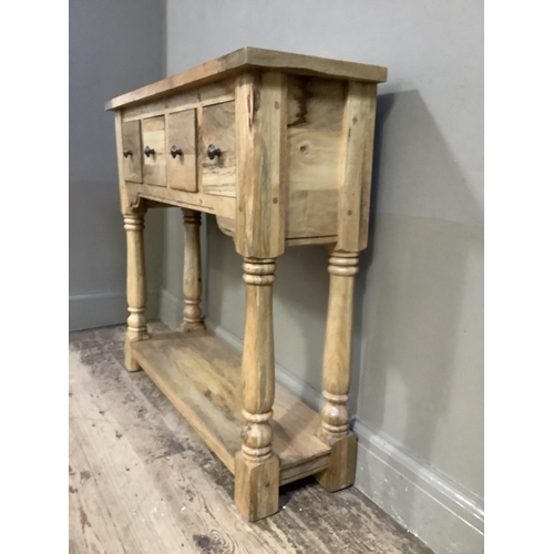 78 - A modern hardwood side table of four square drawers on turned uprights joined by a platform and squa... 