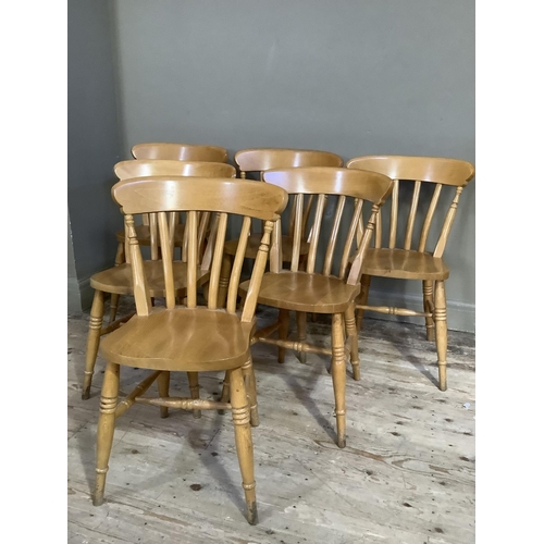 92 - A set of six beech rail back dining chairs on turned legs