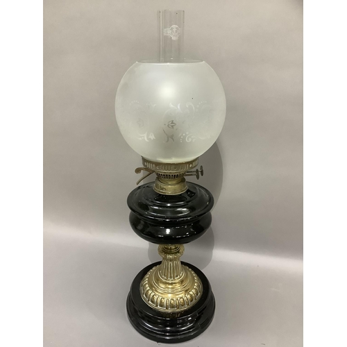 330 - A Victorian black glass and brass oil lamp with opaque etched shade