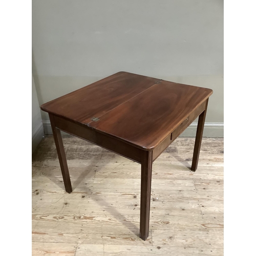 338 - A 19th century mahogany fold over tea table with small drawer to the apron and on moulded square leg... 