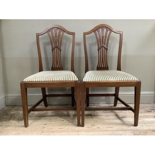 341 - A pair of Hepplewhite style mahogany dining chairs with pierced splats, drop in upholstered seats an... 