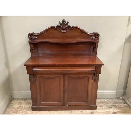 342 - A 19th century mahogany chiffonier having a raised back with applied moulded foliage and serpentine ... 