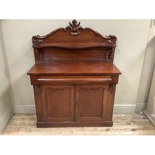 342 - A 19th century mahogany chiffonier having a raised back with applied moulded foliage and serpentine ... 