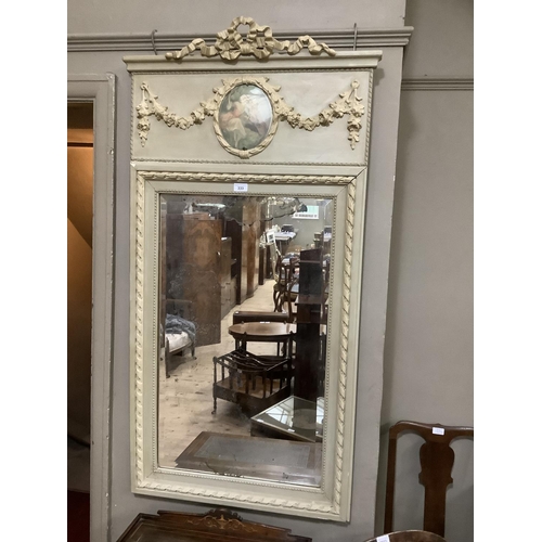 302 - A reproduction French style wall mirror in pale green having a ribboned cresting above a panel inset... 