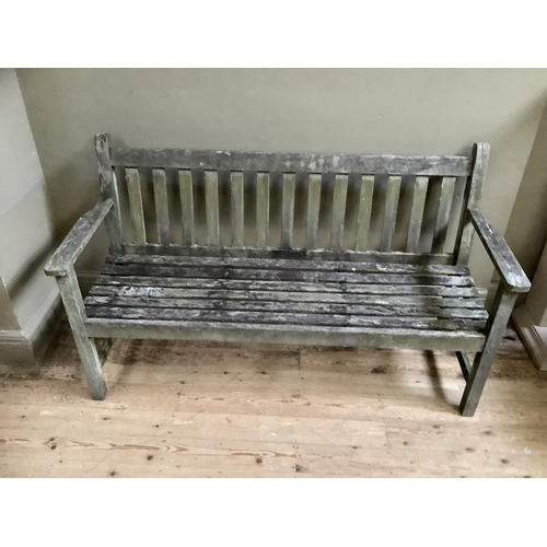 318 - A teak garden bench, 152cm (repair to slats)