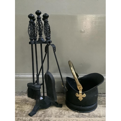 310 - A set of black metal fire irons and stand with matching coal bucket