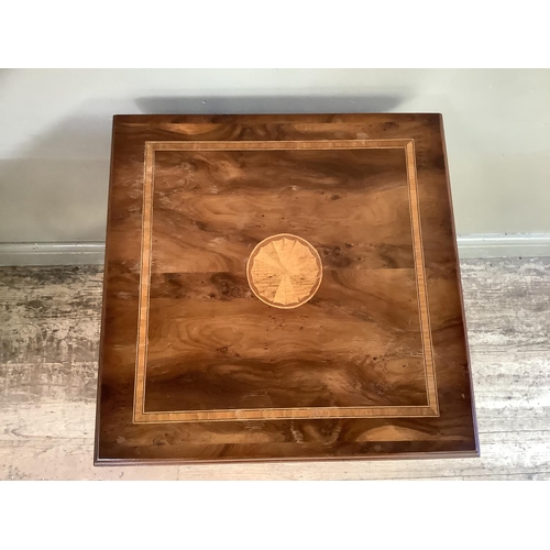 315 - A reproduction Edwardian mahogany and inlaid revolving book stand, 47cm by 86cm high