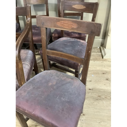 324 - A matched set of eight mahogany early 19th century dining chairs inlaid to the bar back with a satin... 