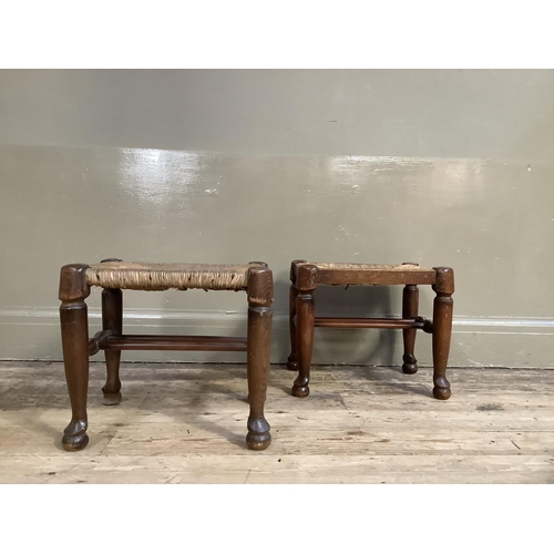 340 - Two rush seated stools on turned legs with pad feet