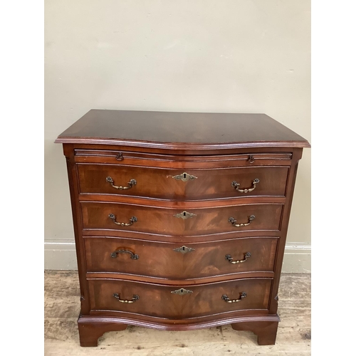 351 - A reproduction mahogany serpentine fronted chest of four long graduated drawers on bracket feet, 70c... 