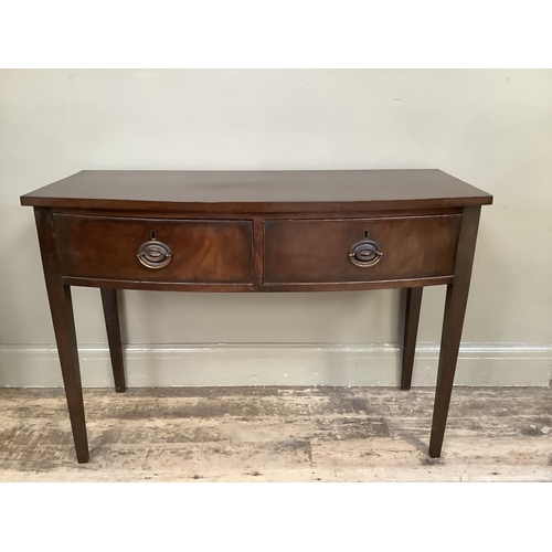 354 - A mahogany bow fronted side table with two drawers and on square legs, 105cm wide