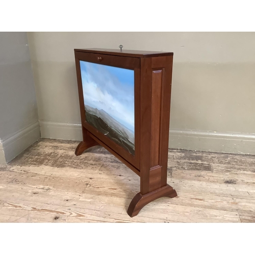 357 - A mahogany portfolio cabinet, double sided, drop fronts, one side painted with a landscape at dusk a... 