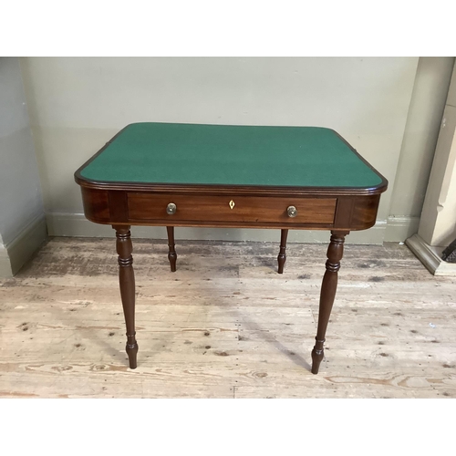 358 - A 19th century mahogany fold over card table, rectangular with rounded corners, the deep frieze with... 