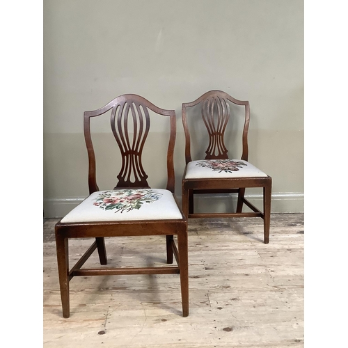 360 - A pair of 19th century mahogany single chairs having an arched top rail over a pierced vase splat an... 