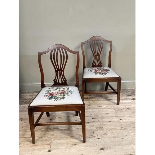 360 - A pair of 19th century mahogany single chairs having an arched top rail over a pierced vase splat an... 