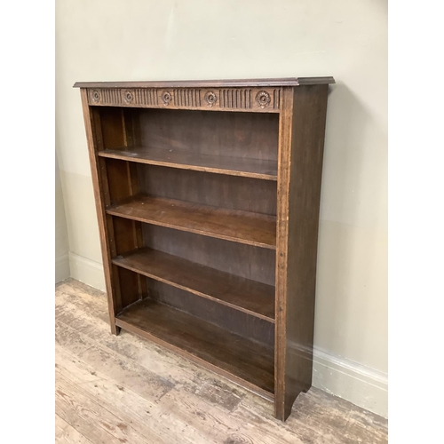 365 - An set of oak open book shelves with rose carved frieze on square legs, 91cm wide x 23cm deep x 107c... 