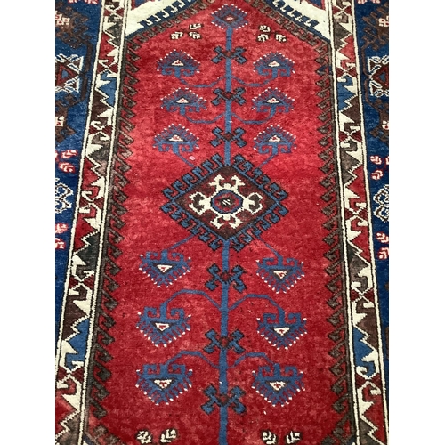 368 - A Turkish village rug, 182cm x 125cm