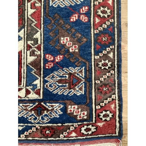 368 - A Turkish village rug, 182cm x 125cm