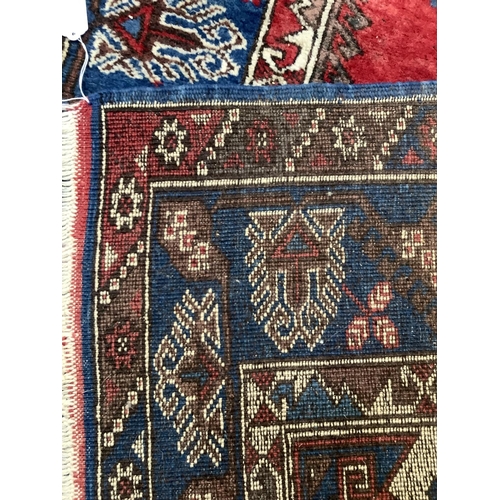 368 - A Turkish village rug, 182cm x 125cm