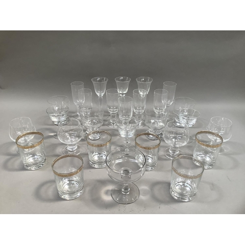 104 - A set of six French glass tumblers with gilt Greek key banding to the rim, a set of seven flutes wit... 