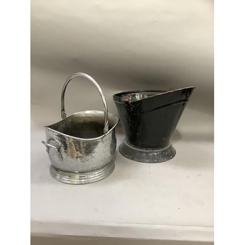 312 - A chromed coal bucket together with a black enamelled coal bucket