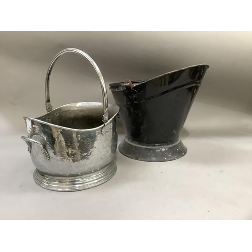 312 - A chromed coal bucket together with a black enamelled coal bucket