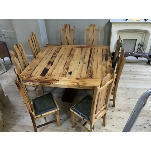 390 - A dining table and chairs by Jarobsky, made from South African railway sleepers comprising large squ... 