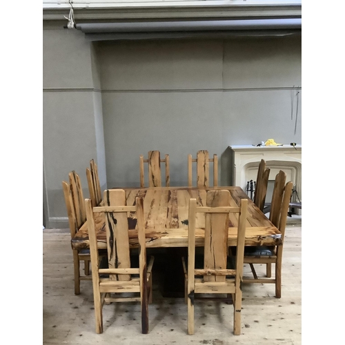 390 - A dining table and chairs by Jarobsky, made from South African railway sleepers comprising large squ... 