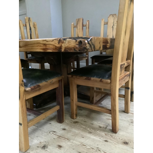 390 - A dining table and chairs by Jarobsky, made from South African railway sleepers comprising large squ... 