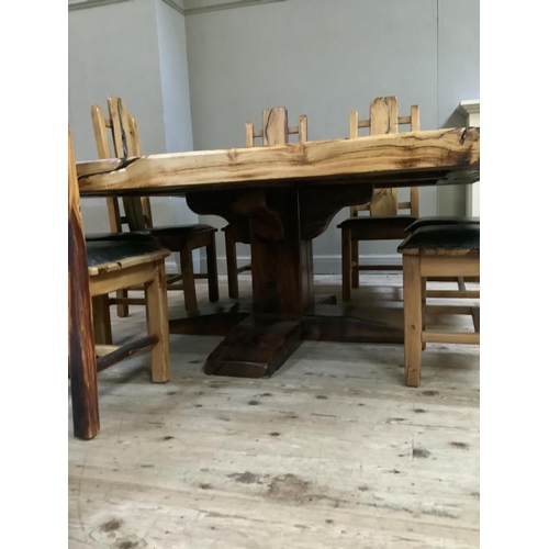 390 - A dining table and chairs by Jarobsky, made from South African railway sleepers comprising large squ... 