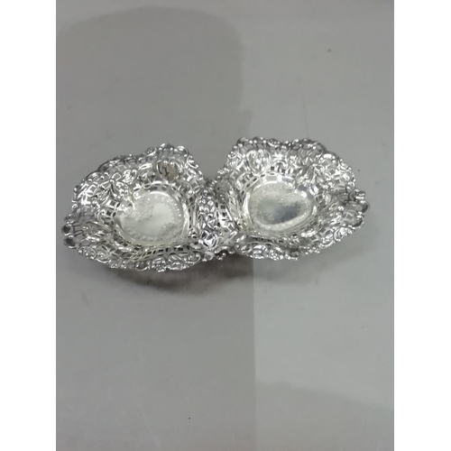 237 - A pair of Edward VII silver pierced bon bon dishes, Sheffield 1902, engraved to the centre within pi... 