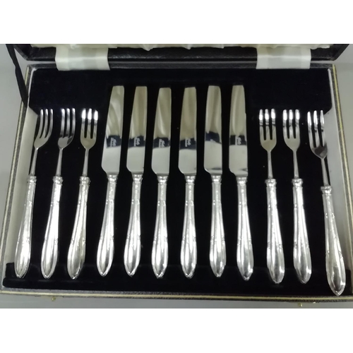 239 - A cased of set of six silver handled fruit knives and forks, Sheffield 1935/36, with jubilee mark