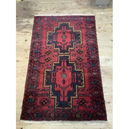 361b - A middle eastern rug of red ground