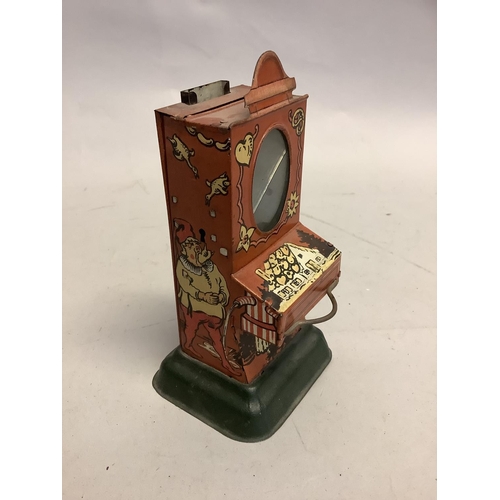 3 - An early 20th century tinplate chocolate dispenser, possibly German, of vending machine form with ov... 