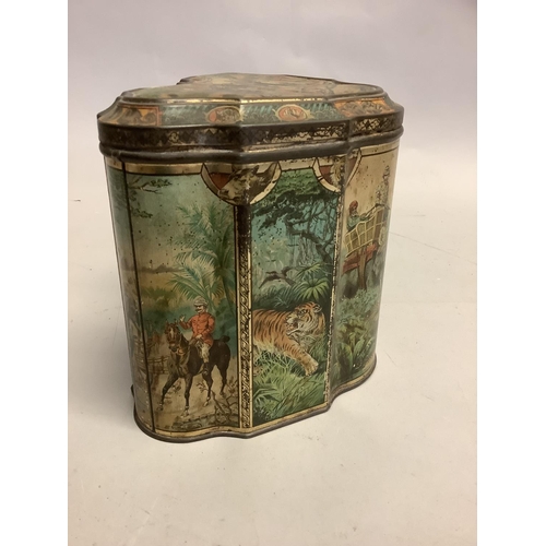 4 - A rare Huntley & Palmer's Elephant Tiger Hunt printed biscuit tin c.1895 of shield shape the lid and... 