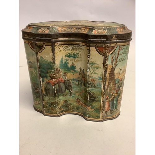 4 - A rare Huntley & Palmer's Elephant Tiger Hunt printed biscuit tin c.1895 of shield shape the lid and... 