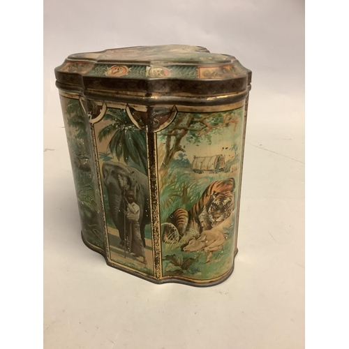 4 - A rare Huntley & Palmer's Elephant Tiger Hunt printed biscuit tin c.1895 of shield shape the lid and... 