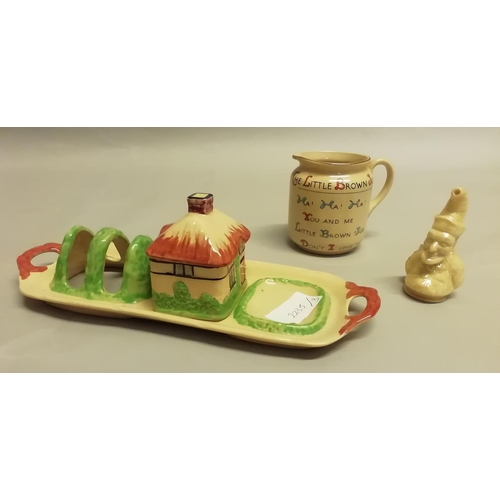 352 - A W. H. Goss Royal Buff, 'The Little Brown Jug', 7.5cm high, a yellow lustre glazed Punch and Judy c... 