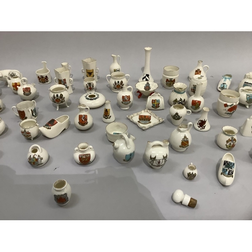 354 - W. H. Goss porcelain models, various with crests including Princess Victoria's first shoe with Isle ... 