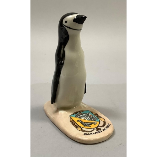 346 - A W. H. Goss porcelain model of a penguin with Falkland Islands crest, printed mark 'W. H. Goss Engl... 