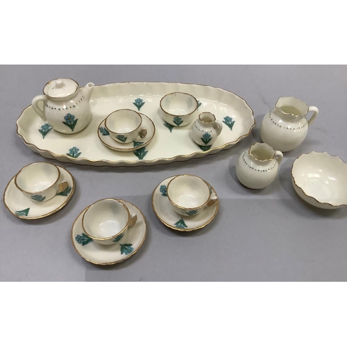 350 - A W. H. Goss porcelain miniature tea service on an oval tray (16cm long) comprising teapot, milk jug... 