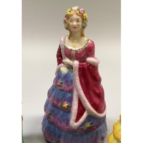 351 - A W. H. Goss porcelain figures The Bridesmaid, in yellow with pink trim, Rd. no. 769525, 14cm high, ... 